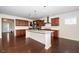 Spacious kitchen with granite countertops, dark wood cabinets, and a large center island at 518 Parlier Dr # 82, Apex, NC 27523