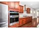 Gourmet kitchen featuring stainless steel appliances, granite countertops, and custom cabinetry at 518 Parlier Dr # 82, Apex, NC 27523