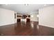 Open concept living space with hardwood floors and view of the kitchen island, enhancing the flow at 518 Parlier Dr # 82, Apex, NC 27523