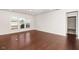 Spacious living room featuring hardwood floors, large windows, and fresh neutral paint at 518 Parlier Dr # 82, Apex, NC 27523