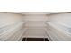 Walk-in pantry with wire shelving and hardwood floors, providing ample storage space at 518 Parlier Dr # 82, Apex, NC 27523