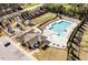 Aerial view of a community pool, playground and clubhouse in a residential neighborhood at 518 Parlier Dr # 82, Apex, NC 27523