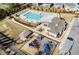 An aerial view of community amenities showcasing a pool, clubhouse, playground, and parking at 518 Parlier Dr # 82, Apex, NC 27523
