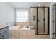 This bathroom features a soaking tub and a glass enclosed shower at 52 Reserve Dr, Fuquay Varina, NC 27526