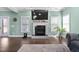 Bright and airy living room with fireplace, neutral walls, and view to the outdoors, creating a cozy atmosphere at 52 Reserve Dr, Fuquay Varina, NC 27526