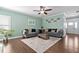 Inviting living room with hardwood floors, neutral paint, stylish sofas, and a bright, airy feel at 52 Reserve Dr, Fuquay Varina, NC 27526
