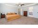 This spacious main bedroom offers carpet, ceiling fan, and tray ceiling at 52 Reserve Dr, Fuquay Varina, NC 27526