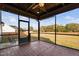 Covered patio with brick flooring, ceiling fan, string lights, and backyard view at 52 Reserve Dr, Fuquay Varina, NC 27526
