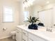 Elegant bathroom with dual sinks, granite countertops, and modern fixtures at 521 Ivy Arbor Way, Holly Springs, NC 27540