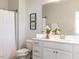 Bright bathroom featuring white vanity, modern fixtures, and decorative 'wash your hands' art at 521 Ivy Arbor Way, Holly Springs, NC 27540