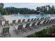 Spacious community pool area with ample seating and a slide, perfect for summer fun and relaxation at 521 Ivy Arbor Way, Holly Springs, NC 27540