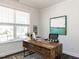 Bright office space with a large window, desk, and decorative artwork creating a great work environment at 521 Ivy Arbor Way, Holly Springs, NC 27540
