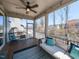 Relaxing screened porch with comfortable seating, string lights, and view of the backyard at 521 Ivy Arbor Way, Holly Springs, NC 27540