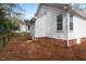 Exterior view of the home's backyard with pine straw at 528 Moseley Ln, Raleigh, NC 27601