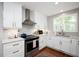 Modern kitchen with stainless steel appliances, stylish countertops, and ample cabinet space at 528 Moseley Ln, Raleigh, NC 27601