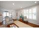 Open-concept living room area with hardwood floors and comfortable seating at 528 Moseley Ln, Raleigh, NC 27601