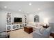 Bright living room boasts neutral tones, built-in shelving, and comfortable seating at 528 Moseley Ln, Raleigh, NC 27601
