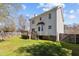 Exterior view of a beautiful backyard with a wooden deck and lush green grass at 5313 Wenesly Ct, Raleigh, NC 27616