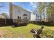 Spacious backyard featuring a fire pit with chairs at 5313 Wenesly Ct, Raleigh, NC 27616