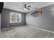 Well-lit bedroom featuring a large window and contemporary decor at 5313 Wenesly Ct, Raleigh, NC 27616