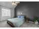 Primary bedroom features a high ceiling, neutral paint, carpet, and natural light from windows at 5313 Wenesly Ct, Raleigh, NC 27616