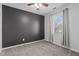 Cozy bedroom features neutral tones, ample natural light, and a ceiling fan at 5313 Wenesly Ct, Raleigh, NC 27616