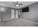 Comfortable bedroom with soft carpet, a ceiling fan, and a convenient closet at 5313 Wenesly Ct, Raleigh, NC 27616