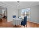 Open floor plan with a dining area featuring new light fixtures, and hardwood floors at 5313 Wenesly Ct, Raleigh, NC 27616