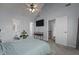 Spacious main bedroom with a ceiling fan, ensuite bathroom, and television at 5313 Wenesly Ct, Raleigh, NC 27616