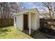 Close up of shed with covered porch with door at 5313 Wenesly Ct, Raleigh, NC 27616