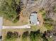 Aerial view of a home with long driveway and surrounded by trees at 5408 Rivercrest Dr, Youngsville, NC 27596
