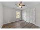 Bedroom featuring a large window and plank flooring at 5408 Rivercrest Dr, Youngsville, NC 27596