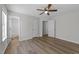 Bright bedroom with ceiling fan, ensuite bath, and plank flooring at 5408 Rivercrest Dr, Youngsville, NC 27596