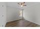 Bedroom featuring a large window and plank flooring at 5408 Rivercrest Dr, Youngsville, NC 27596