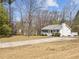 Charming single-story home with a well-manicured lawn and long driveway at 5408 Rivercrest Dr, Youngsville, NC 27596