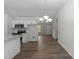 Modern kitchen with sleek countertops, stainless steel appliances, and seamless dining area transition at 5408 Rivercrest Dr, Youngsville, NC 27596