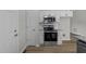 Modern kitchen with sleek appliances, plenty of storage, and stylish granite countertops and backsplash at 5408 Rivercrest Dr, Youngsville, NC 27596