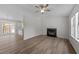 Bright living room features a fireplace, high ceilings, modern flooring, and open floor plan at 5408 Rivercrest Dr, Youngsville, NC 27596