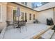 Back patio featuring an outdoor dining set, grill, and a lounge chair at 56 Mist Wood Ct, Pittsboro, NC 27312