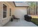 Back patio with a lounge chair and a grill for outdoor relaxation and cooking at 56 Mist Wood Ct, Pittsboro, NC 27312