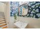 Powder room with wainscoting, floral wallpaper, and a pedestal sink at 56 Mist Wood Ct, Pittsboro, NC 27312