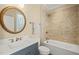 Stylish bathroom featuring a tub-shower, decorative mirror, and modern vanity with elegant fixtures at 56 Mist Wood Ct, Pittsboro, NC 27312