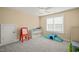 Bright bedroom with carpeted floor, natural light, and storage for toys and games at 56 Mist Wood Ct, Pittsboro, NC 27312
