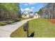 Lovely home with brick facade, well-manicured lawn and mature landscaping at 56 Mist Wood Ct, Pittsboro, NC 27312