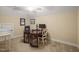 Carpeted home office with desk, rolling chairs, decorations, and natural light at 56 Mist Wood Ct, Pittsboro, NC 27312