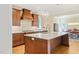Gourmet kitchen featuring an island, custom cabinetry, and modern appliances at 56 Mist Wood Ct, Pittsboro, NC 27312