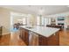 Open-concept kitchen island featuring a stainless steel dishwasher and bar sink with pendant lighting at 56 Mist Wood Ct, Pittsboro, NC 27312
