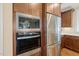 Kitchen featuring stainless steel appliances, including a refrigerator, microwave, and oven at 56 Mist Wood Ct, Pittsboro, NC 27312