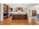 Large kitchen with center island, stainless steel appliances, and hardwood floors at 56 Mist Wood Ct, Pittsboro, NC 27312