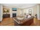 Inviting living room featuring a fireplace, rich leather sofa, and classic decor at 56 Mist Wood Ct, Pittsboro, NC 27312